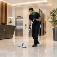 Home Professional cleaner mopping a modern building lobby in Dubai