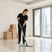 Home HMCS cleaner mopping an empty apartment during move-out cleaning